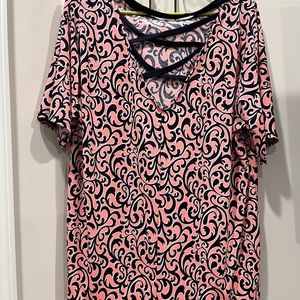 Beautiful coral and navy top with cross cross fun in the back